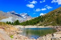 View of Grunsee lake (Green Lake) and the Swiss Alps at summer