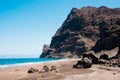Scenic view of gui gui beach in gran canaria island in spain with spectacular mountains landscape and clear blue sky and sandy Royalty Free Stock Photo