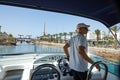 View of the Gulf of Eilat with luxury yachts. Captain standing on the bridge of control waiting for the opening of the bridge