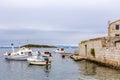 View of the gulf with motor boats and old house near the island of Vis, Croatia Royalty Free Stock Photo