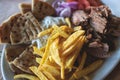 View of Gyros on a plate - traditional greek cuisine dish with kebab meat and pita bread with french fries and tzatziki sauce Royalty Free Stock Photo