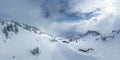 view of the hahnenkamm ski area in winter with fresh snow