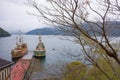 View of Hakone sightseeing cruise pirate ships docks on pier of Togendai Station at Lake Ashi, Kanagawa, Japan.
