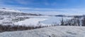 View of the Hallingskarvet National Park from the frozen Sloddfjorden lake Royalty Free Stock Photo
