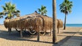 Hammock under palm leaf canopy on the sand beach Royalty Free Stock Photo