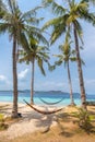 View of hammocks on tropical beach on the Banana island Royalty Free Stock Photo