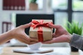 view of hands Giving a business gift in an office, corporate party celebration concept Royalty Free Stock Photo