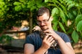 View on a man holding a baby turkey in his hands