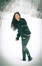 View of happy brunette girl playing with snow in winter landscape. Beautiful young female on winter background. Attractive woman Royalty Free Stock Photo