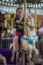 Happy young boy having fun on boardwalk amusement ride Royalty Free Stock Photo