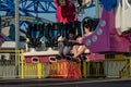 Happy young brother and sister having fun on boardwalk amusement ride Royalty Free Stock Photo