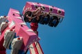 Happy young brother and sister having fun on boardwalk amusement ride Royalty Free Stock Photo