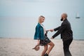 Happy young couple have fun on the beach, holding hands. Royalty Free Stock Photo