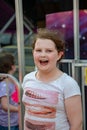 Happy young girl having fun on boardwalk amusement ride Royalty Free Stock Photo