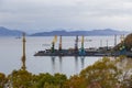 View of harbor cranes in the shipyard, Petropavlovsk-Kamchatsky, Russia.