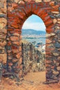 View of harbor through stone arch of Alanya Castle