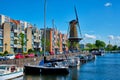 View of the harbour of Delfshaven and the old grain mill De Destilleerketel. Rotterdam, Netherlands Royalty Free Stock Photo