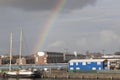 A view of a harbour with a ship and a rainbow located at Amsterdam,The Netherlands