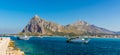 A view of harbour traffic at San Vito lo Capo, Sicily with impressive mountain backdrop