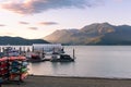 View of Harrison Lake and pier with boat rentals at sunset in summer