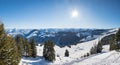 View from Hartkaiser mountain to skiing area and wintry alps