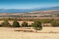 View of harvest field and mountains Royalty Free Stock Photo