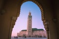 view of Hassan II mosque framed by the arch of a big gate