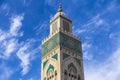 View of Hassan II mosque tower against blue sky - The Hassan II Mosque or Grande MosquÃÂ©e Hassan II is a mosque in Casablanca,