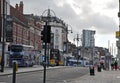 View of the headrow in Leeds with victoria quarter shops and traffic on the road