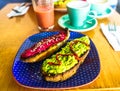 View on healthy avocado and beetroot toasts for breakfast in Colombia