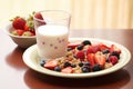 a view of a healthy breakfast: whole grain cereal, milk and berries