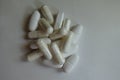 View of heap of capsules of magnesium citrate and caplets of calcium citrate