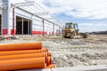 View on heavy bulldozer while he moving, leveling ground at cons