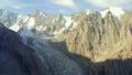 View from the height of the Aksai glacier. A picturesque mountain landscape. Beautiful snow-capped mountains, ridges,