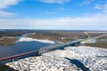 View from the height of the bridge over the river Nadym during the ice drift in Northern Siberia