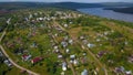 View from the height . Clip . A small summer village with a river, small residential houses and roads, a green forest Royalty Free Stock Photo