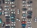 A view from a height to the parking lot. The process of parking. Searching for space in a busy car park. Parking maneuvers. Park Royalty Free Stock Photo
