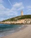 View of Hercules tower roman lighthouse from Lapas beach in the city of a coruna in a sunny day, Galicia, Spain