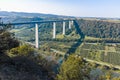 View on high freeway viaduct bridge across Mosel river valley and terraced vineyards, road network and transportation is Germany