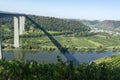 View on high freeway viaduct bridge across Mosel river valley and terraced vineyards, road network and transportation is Germany