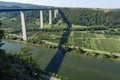 View on high freeway viaduct bridge across Mosel river valley and terraced vineyards, road network and transportation is Germany