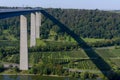 View on high freeway viaduct bridge across Mosel river valley and terraced vineyards, road network and transportation is Germany