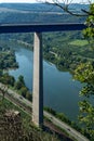 View on high freeway viaduct bridge across Mosel river valley and terraced vineyards, road network and transportation is Germany
