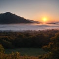 A view of the high hills at sunset on a foggy day. Royalty Free Stock Photo