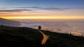 View from the high mountain to the evening sky of Puerto de la Cruz with many lights under the clouds. Royalty Free Stock Photo