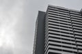 View of High-rise office building wall with sky and clouds. Architecture detail Royalty Free Stock Photo