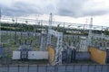 View on high voltage electricity power distribution plant with electricity pillars and ceramic insulator. Royalty Free Stock Photo