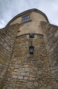 View of high wall with window and embrasure in ancient Olesko castle. Lviv region in Ukraine. Cloudy summer day Royalty Free Stock Photo