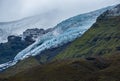 View from highway road during auto trip in Iceland. Spectacular Icelandic landscape with  scenic nature: hamlets, mountains, ocean Royalty Free Stock Photo