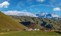 View from highway road during auto trip in Iceland. Spectacular Icelandic landscape with scenic nature: hamlets, mountains, ocean Royalty Free Stock Photo